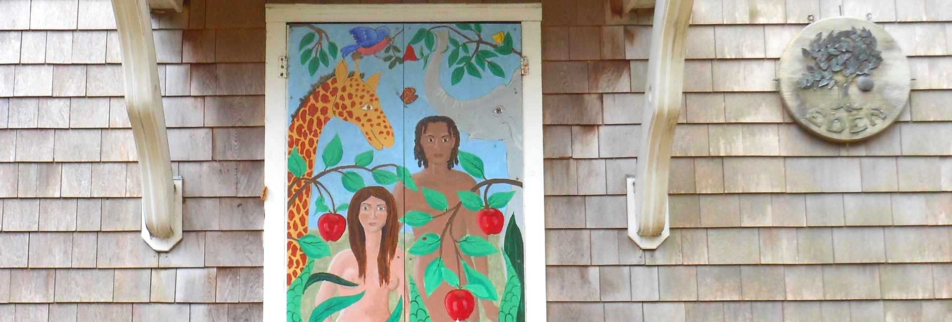 Painting of the Garden of Eden on the door to the Eden Hand Arts shop